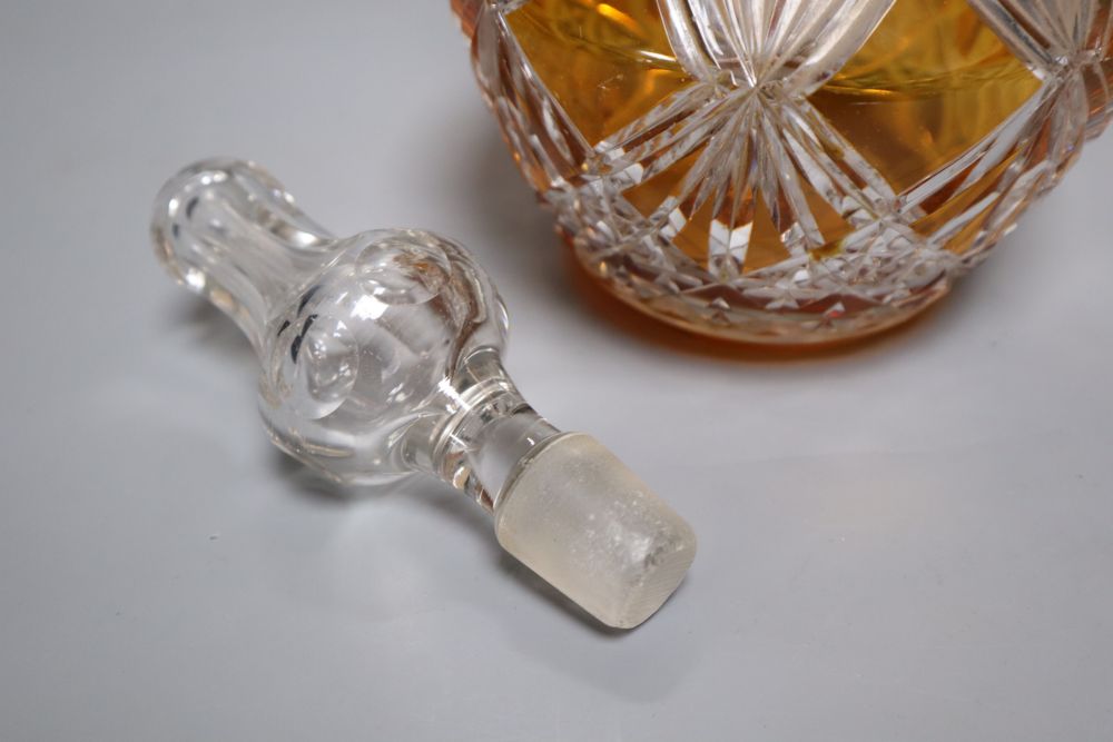 A tall amber-flashed glass decanter and clear stopper, height 48cm